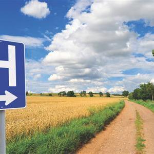 Hospital sign in a rural area.