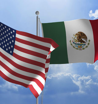The flags of the United States of America and Mexico.